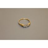 An 18ct gold three stone diamond ring, total diamond weight estimated at 0.