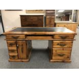 A plantation pine double pedestal desk, width 165 cm.