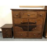 A contemporary mahogany nine drawer block chest,