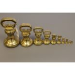 A 19th century graduated set of ten brass weights by Parnall & Sons Ltd of Swansea,