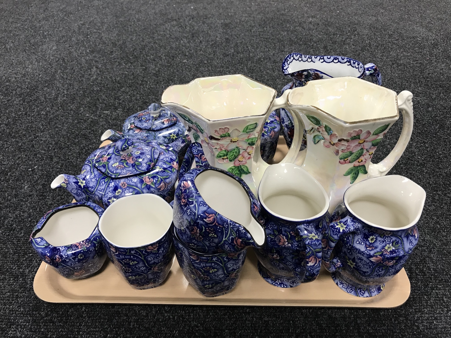 A tray of ten pieces of Ringtons chintz china and a pair of Maling lustre jugs