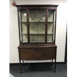 A Victorian mahogany display cabinet fitted cupboards beneath