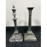 A plated Corinthian column candlestick together with one other