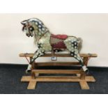 A wooden rocking horse CONDITION REPORT: Length 108cm.