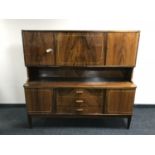 A mid 20th century walnut cocktail sideboard