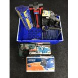 A box of power tools, extension leads, tile cutters, boxed bench vice,