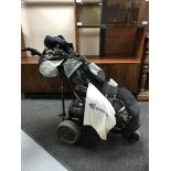 An electric Power Caddy golf cart with battery and charger,