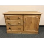 A Victorian style pine low chest fitted with a cupboard, width 120 cm.