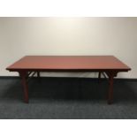 A red lacquered oriental style dining table CONDITION REPORT: This measures 210cm