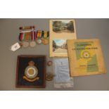 A First and Second World War medal group comprising WWI British War medal and Victory medal (both