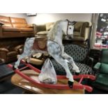 A mid 20th century wooden painted rocking horse, by Honeycombe Horses, height 98 cm.