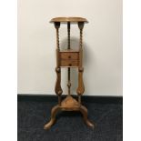 A mahogany wig stand fitted two drawers