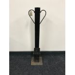 A metal driveway security post