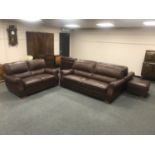 A brown leather five piece lounger suite : pair of three seater settees, two seater settee,