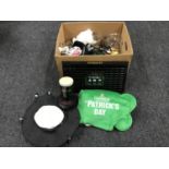 A box of Guinness pub merchandise - hat, glasses,