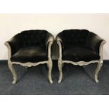 A pair of wood framed button backed dressing table chairs