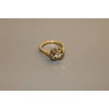 An 18ct gold diamond cluster ring, the central stone estimated at 0.