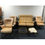 A six piece Ercol lounge suite - two seater settee,