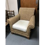 A wicker conservatory armchair