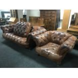 A brown button leather Chesterfield settee,