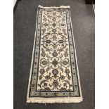 A Tabriz design runner on cream ground,