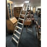 A set of folding wooden step ladders