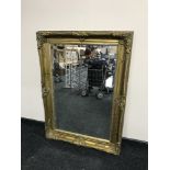 An ornate gilt framed mirror