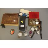 A box containing Ingersoll Triumph pocket watch, Roamer wristwatch, other watches,