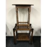 An oak occasional table and oak serving trolley