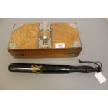 A Victorian style police truncheon and an oak two-division cigarette box with silver plated mounts