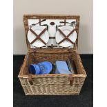 A large wicker Optima picnic basket and contents
