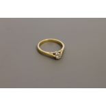 An 18ct gold diamond solitaire ring, approximately 0.25ct, size M.