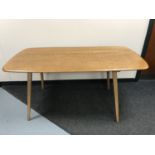 An Ercol elm dining table
