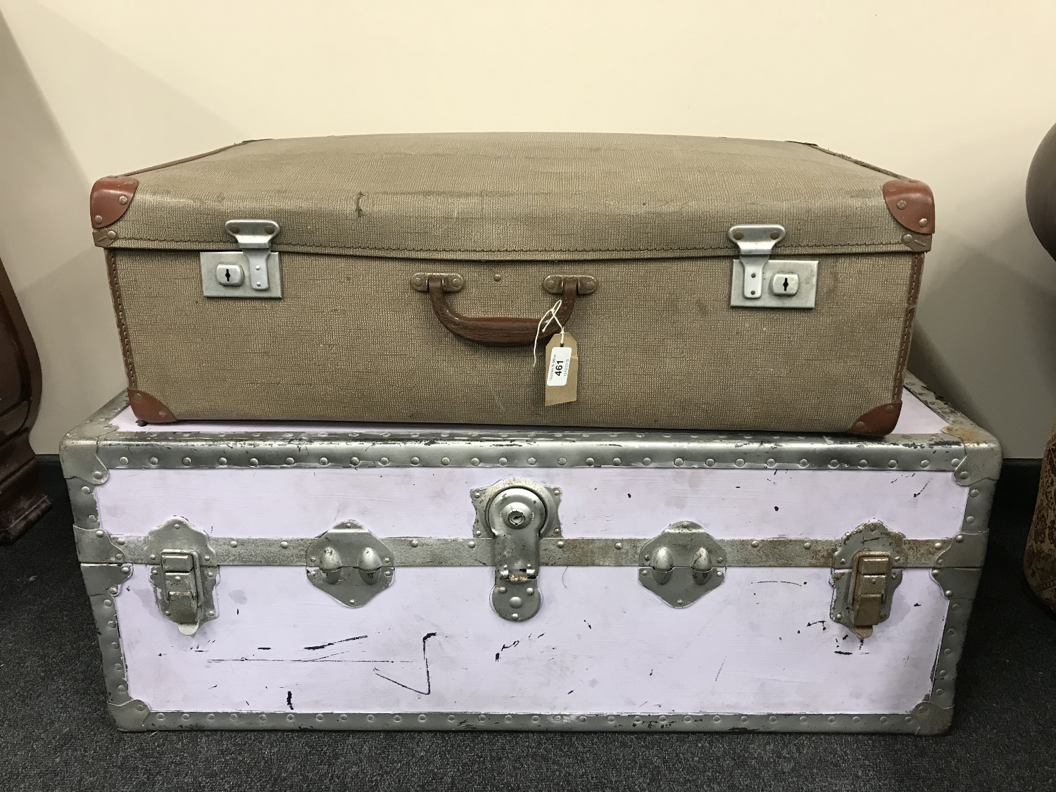 A metal bound trunk and a vintage luggage case