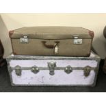 A metal bound trunk and a vintage luggage case