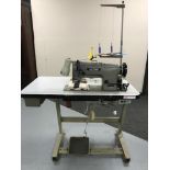 A Brother industrial treadle sewing machine in table