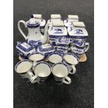 A tray of seventeen pieces of Ringtons willow pattern china - teapots, vases,