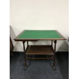A mahogany foldover card table with gallery