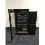 An oak audio cabinet continuing Aiwa hi/fi and speakers,