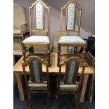 A set of four Edwardian oak dining chairs