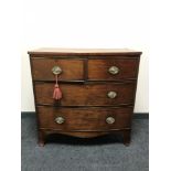 A Victorian inlaid mahogany bowfronted four drawer chest
