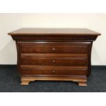 A three drawer chest in a mahogany finish CONDITION REPORT: 83cm high x 111cm wide
