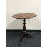 A Victorian mixed wood tilt topped pedestal table