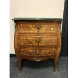 A continental inlaid walnut bombe three drawer ormolu mounted chest,