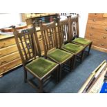 A set of four mahogany Arts & Crafts dining chairs