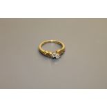 An 18ct gold two-stone diamond ring, approximately 0.2ct, size M/N.