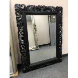 A black framed mirror, 94 cm x 120 cm.