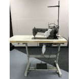 A Brother industrial treadle sewing machine in table