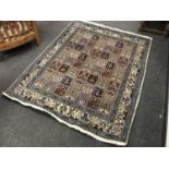 A Persian Ghom design rug on cream ground,
