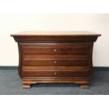 A three drawer chest in a mahogany finish CONDITION REPORT: 83cm high x 111cm wide